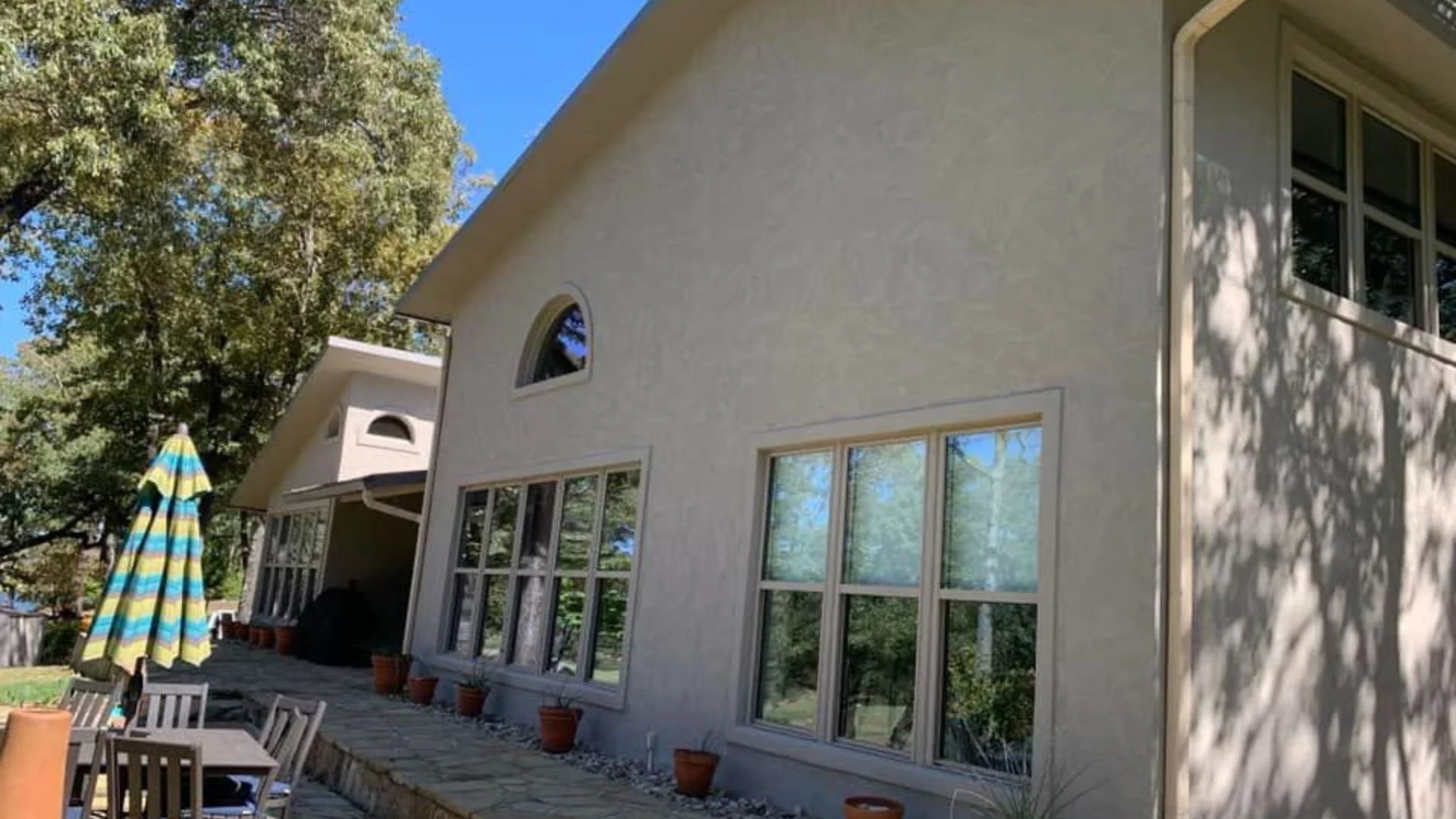 Beige stucco house exterior with finished windows by ABC Masonry and Stucco Contractors, NYC 5 boroughs